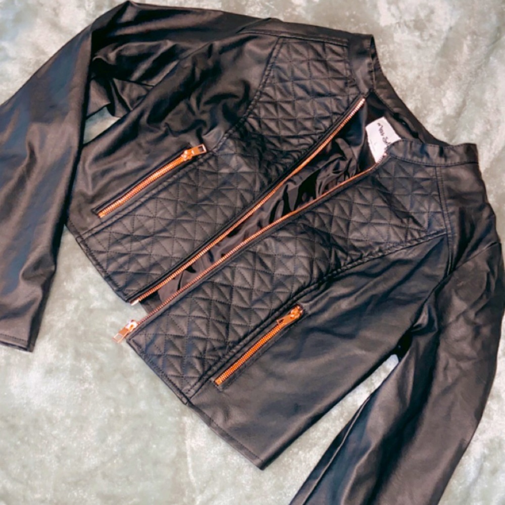 Black biker styled jacket.